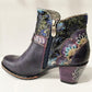 Colorful patterned ankle boot with a zipper on a light background